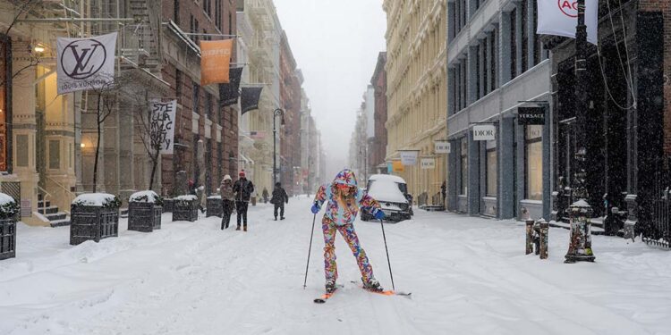 Woman skiing in Soho in a snowstorm in New York